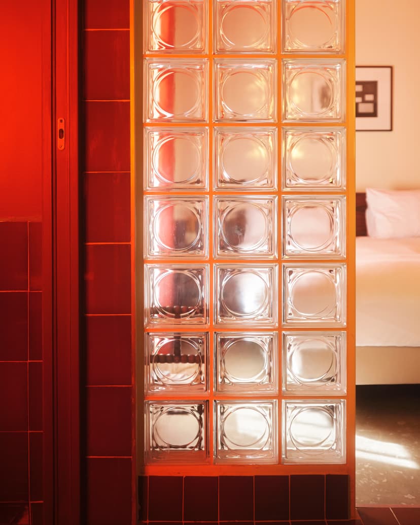 A separation between the bathroom and the bedroom